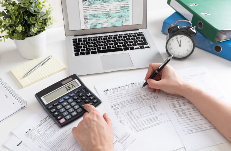 Small business owner reviewing outsourced bookkeeping records